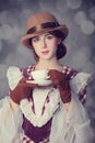 Beautiful redhead women with cup of tea. Royalty Free Stock Photo