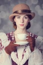 Beautiful redhead women with cup of tea. Royalty Free Stock Photo