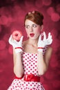 Beautiful redhead women with donut. Royalty Free Stock Photo