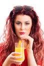 Beautiful redhead young woman drinking orange juice Royalty Free Stock Photo