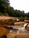 Beautiful refelction of lake water and stones Royalty Free Stock Photo