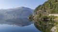 Beautiful reflection of mountains in the waters of Suldalsvatnet lake