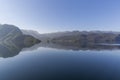 Beautiful reflection of mountains in the waters of Suldalsvatnet lake