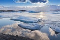 Beautiful reflection natural background over Jakulsarlon lake during late winter, Iceland Royalty Free Stock Photo