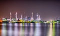 Beautiful reflection of Oil refineries located along the river with dark sky background-Image Royalty Free Stock Photo