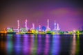 Beautiful reflection of Oil refineries located along the river with dark sky background-Image Royalty Free Stock Photo