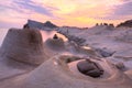 Beautiful reflection of rosy sunrise sky at Yehliu Coast Geologic Park with candlestick rock formations