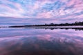 Beautiful reflection of the sky at sunset in the water on the river. Spring background Royalty Free Stock Photo