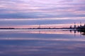 Beautiful reflection of the sky at sunset in the water on the river. Spring background Royalty Free Stock Photo