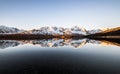 Beautiful reflection of snow covered mountains at a lake in northern norway at sunrise Royalty Free Stock Photo