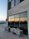 Beautiful reflection of the sunset in the windows to the sea. Kusadasi, Turkey Royalty Free Stock Photo