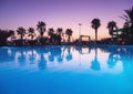 Beautiful reflection in swimming pool at colorful sunset Royalty Free Stock Photo