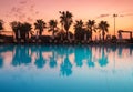 Beautiful reflection in swimming pool at colorful sunset Royalty Free Stock Photo
