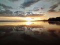 Beautiful reflection of tranquil golden sunset beach view