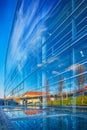 Beautiful reflections and mirroring of a landscape on a building glass facade Royalty Free Stock Photo