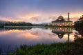 Beautiful reflections of mosque during sunrise