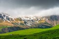Beautiful relief mountains with snow in June, Caucasus landscape on a cloudy day