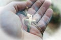 Beautiful Religious Art With Gold Cross In Palm Of Hand With Spiral Galaxy Royalty Free Stock Photo