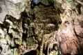 A beautiful Resava cave (Resavska pecina) in Serbia, massive columns of stalagmites and stalactites on the cave bottom.