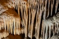 A beautiful Resava cave (Resavska pecina) in Serbia, massive columns of stalagmites and stalactites on the cave bottom.