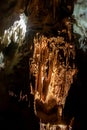 A beautiful Resava cave (Resavska pecina) in Serbia, massive columns of stalagmites and stalactites on the cave bottom.