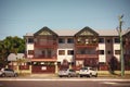 Beautiful residential house with balconies and parked cars in Cairns, Australia