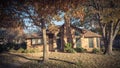 Beautiful residential house entrance with colorful fall foliage near Dallas Royalty Free Stock Photo