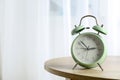 Beautiful retro alarm clock on table Royalty Free Stock Photo