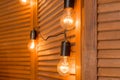 Beautiful retro luxury light lamp decor glowing.Decorative bulbs in vintage style Edison.Garland Light Bulb.Evening Wooden Stage Royalty Free Stock Photo