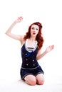 Beautiful retro pin-up girl in a sailor style dress Royalty Free Stock Photo