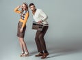 beautiful retro styled couple dancing with vintage radio Royalty Free Stock Photo