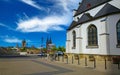 Beautiful rhine riverside street, white church, skyline with dome background, blue summer sky