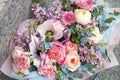 Beautiful wedding pink bouquet, flowers arrangement by florist with roses, lilac and blue flowers. Floral background Royalty Free Stock Photo