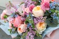 Beautiful wedding pink bouquet, flowers arrangement by florist with roses, lilac and blue flowers. Floral background Royalty Free Stock Photo