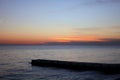 Beautiful rich panorama of the sea landscape in the rays of the setting sun over the horizon. Calm sea at sunset Royalty Free Stock Photo