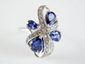 Beautiful ring with tanzanite stone lay on white background