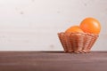 Beautiful ripe oranges on brown table