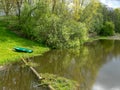 A beautiful river bank in the spring and a lonely boat Royalty Free Stock Photo