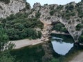 beautiful river flowing trough a gate of stone in a forest Royalty Free Stock Photo