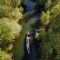 Beautiful river, a forest along the banks, a canoe boat floats along the river, a view from the top, aerial photography, Royalty Free Stock Photo