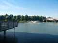 A beautiful river fountain spouts out of the water on a Sunny day.