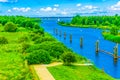 Beautiful river landscape with footpath poles and boats sky view Royalty Free Stock Photo