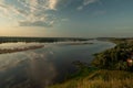 Beautiful river predawn cloudy sky. Early blue sky reflected in water. Colorful morning atmospheric image.