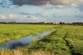 Beautiful river receding into the distance with reflection of clouds