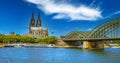 Beautiful river rhine river skyline, medieval gothic dome, Hohenzollern bridge, dramatic blue summer sky - Cologne, Germany Royalty Free Stock Photo