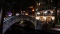 Beautiful Riverwalk in San Antonio with its small restaurants and pubs along the river - view by night - SAN ANTONIO Royalty Free Stock Photo