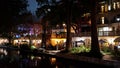 Beautiful Riverwalk in San Antonio with its small restaurants and pubs along the river - view by night - SAN ANTONIO Royalty Free Stock Photo