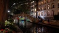 Beautiful Riverwalk in San Antonio with its small restaurants and pubs along the river - view by night - SAN ANTONIO Royalty Free Stock Photo