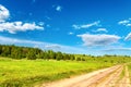 Beautiful road between green grass hills scenery landscape sunny day