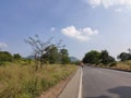 Beautiful road landscape image with vehicle and full of greenery from village In India Royalty Free Stock Photo